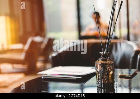 Room aroma fragrant oil reed diffuser. Perfume stick scent surround for indoor fresh good odor air. Stock Photo