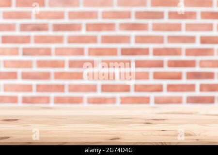 Retro brick wall with wooden table floor space for background advertising montage. Stock Photo