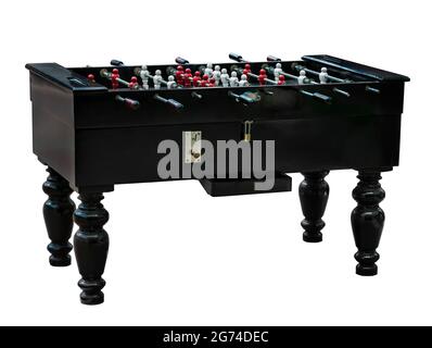 Vintage wooden table soccer or table football, token slot, keypad, isolated image on the white background. Stock Photo