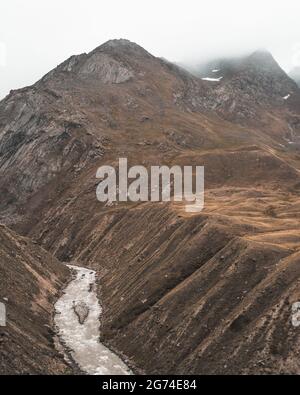 View into a deep gorge, mountain river rushing. Zanskar Valley, trekking in Jammu and Kashmir, impressive, majestic mountains of the Himalaya in India Stock Photo