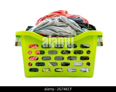 Isolated used cloth in plastic basket on white background, front view of green basket, clothes full in basket. Stock Photo