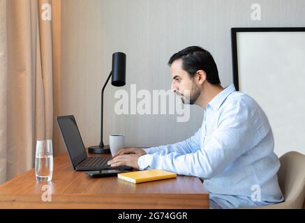 middle aged man working from home Stock Photo
