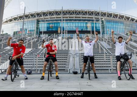 Wembley Park, UK. 11th July, 2021. Dan, Steve, Glenn, and Ben, cycled 29 miles this morning to see Wembley ahead of tonights historic match. Wembley Stadium will host the Euro 2020 Final between Italy and England this evening. It is the first major final that England will have played in since winning the World Cup in 1966. Credit: amanda rose/Alamy Live News Stock Photo