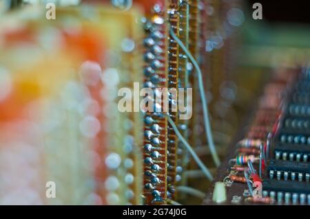 Vintage electronic circuit boards with radio parts and chips, close-up, macro photo, selected focus, grain style. Stock Photo