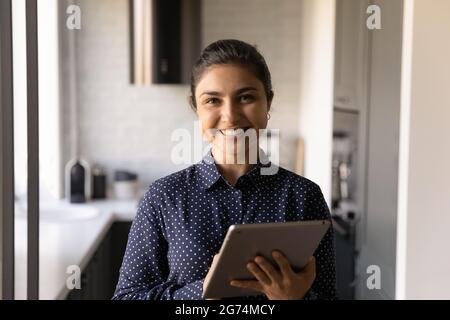 Portrait of happy Indian female customer using app service Stock Photo