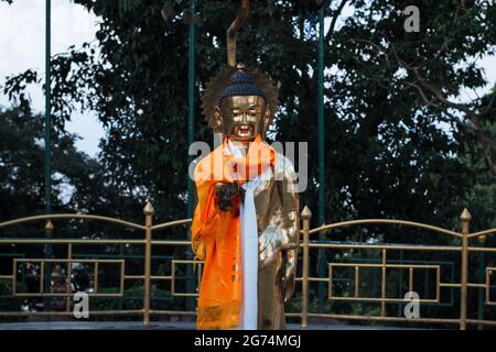 Golden Buddha Statue Throwing Water at Swayambhunath Stock Photo