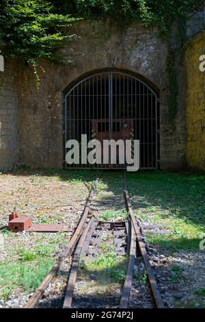 Europe, Luxembourg, near Differdange, Fond-de-Gras, Preserved narrow gauge tracks leading to the entrance of a former Iron Ore Mine Stock Photo