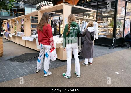 Spitalfields Market interior after covid pandemic lockdown restrictions ease and shoppers looking at stalls in East London UK May 2021   KATHY DEWITT Stock Photo