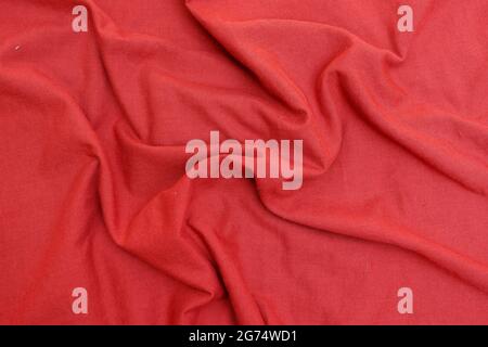 A top view closeup of a wrinkled red cloth texture for a background Stock Photo