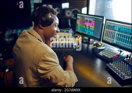 Male dj working on a new hit, recording studio Stock Photo