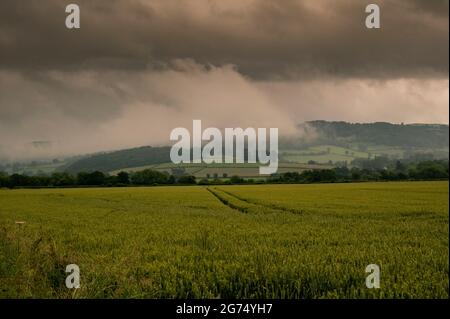 Early morning low misty clouds over the hills in the Brecon Beacons National park Stock Photo