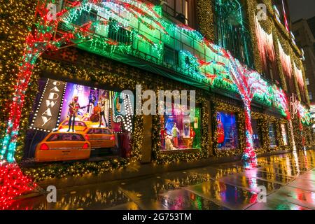 SAKS Fifth Avenue Christmas Light Show glows In the rainy night amidst COVID-19 Stock Photo