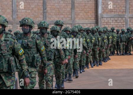 (210711) -- KIGALI, July 11, 2021 (Xinhua) -- Rwandan soldiers wait to board a plane for Mozambique in Kigali, capital city of Rwanda, July 10, 2021.  The Rwandan government on Friday started deploying a 1000-member joint force of army and police personnel to Mozambique to support efforts to restore state authority in the latter's restive region.   The deployment of the contingent comprised of members of Rwanda Defence Force and the Rwanda National Police to Cabo Delgado, Mozambique's gas-rich province that is under threat of the Islamic State-related armed groups and insurgents, is at the req Stock Photo