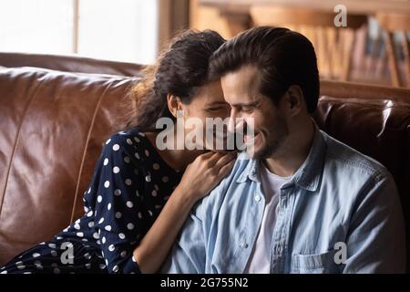 Happy millennial couple enjoying being together in new house Stock Photo