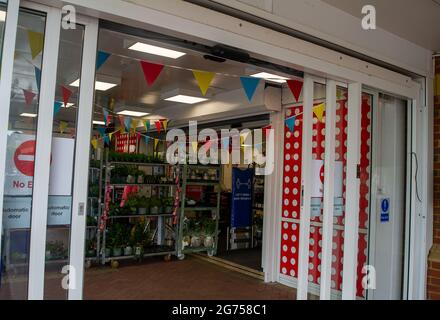 Dedworth, Windsor, Berkshire, UK. 11th July, 2021. Tesco Supermarket in Dedworth has bunting up ahead of the match tonight. Tesco stores in England will be closed tonight so that staff can watch the match. Credit: Maureen McLean/Alamy Live News Stock Photo
