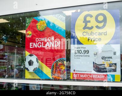 Dedworth, Windsor, Berkshire, UK. 11th July, 2021. Tesco Supermarket in Dedworth has bunting up ahead of the match tonight. Tesco stores in England will be closed tonight so that staff can watch the match. Credit: Maureen McLean/Alamy Live News Stock Photo