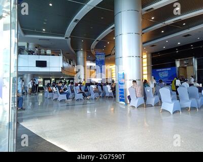 Editorial Photo, Indonesia, South Jakarta, 08 Juli 2021, queueing people at Smesco Building to get vaccine Stock Photo