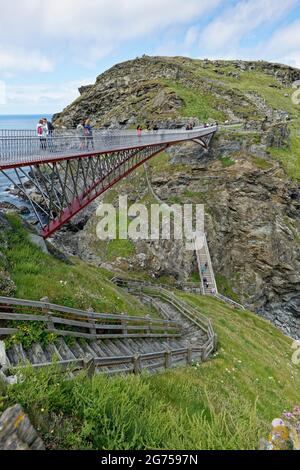 The new contemporary footbridge at Tintagal Castle in Cornwall in the South West of England not only looks beautiful it's highly functional too Stock Photo