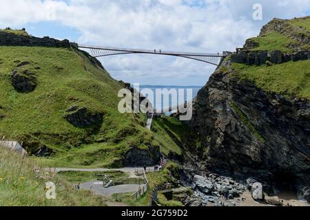 The new contemporary footbridge at Tintagal Castle in Cornwall in the South West of England not only looks beautiful it's highly functional too Stock Photo