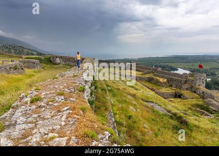 Woman walking on the walls of Rozafa Castle, Shkodra, Albania Stock Photo