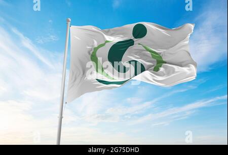 official city flag of Saitama, Saitama waving in the wind on flagpoles against sky with clouds on sunny day. Japan Patriotic concept. 3d illustration. Stock Photo