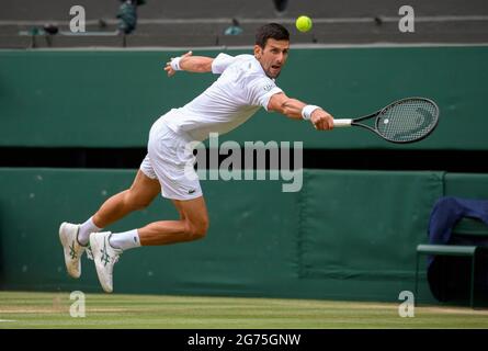 Novak Djokovic (SRB) in action against Matteo Berrettini (ITA) in the final of the Gentlemen's Singles on Centre Court on day thirteen of Wimbledon at The All England Lawn Tennis and Croquet Club, Wimbledon. Picture date: Sunday July 11, 2021. Stock Photo