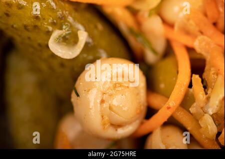 Pickled mushrooms and pickled cucumbers. Close-up Selective focus Stock Photo