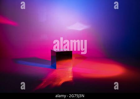 Pink and blue neon lighted background. Mirror light cube with copy space Stock Photo