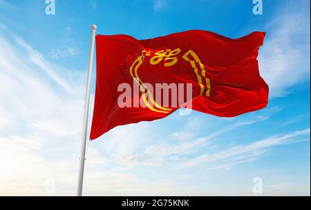 official flag of Niigata prefecture waving in the wind on flagpoles against sky with clouds on sunny day. Japan Patriotic concept. 3d illustration. Stock Photo