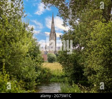 Framed view of Salisbury Cathedral with the River Avon in the foreground in Salisbury, Wiltshire, UK on 11 July 2021 Stock Photo