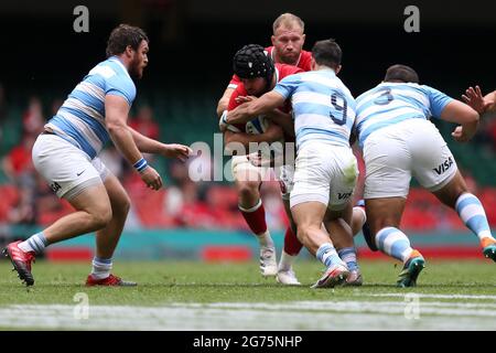 Nicky Smith of Wales is tackled (c). Rugby international friendly , Wales v Argentina, Summer series match at the Principality Stadium in Cardiff on Saturday 10th July 2021. pic by  Andrew Orchard/Andrew Orchard sports photography Stock Photo