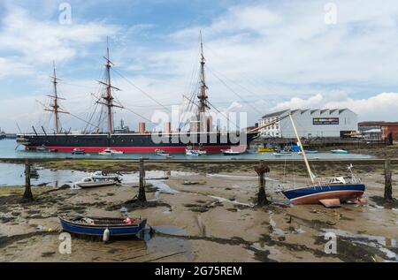 HMS Warrior was Britains first iron-hulled armoured battleship and was powered by steam and sail. Portsmouth Historic Dockyard, Hampshire, England, UK Stock Photo