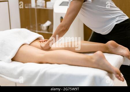 https://l450v.alamy.com/450v/2g75w9t/middle-aged-woman-having-a-leg-massage-in-a-beauty-salon-2g75w9t.jpg