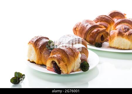 baked sweet homemade buns with plum inside, isolated on white background Stock Photo
