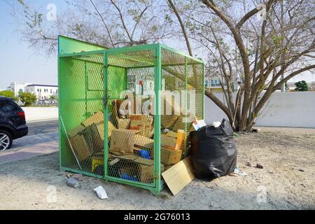 Dubai UAE December 2019 Overflowing Black full garbage bag isolated. Garbage bags, black bin bags. Environment and object concept. Lot of empty cardbo Stock Photo
