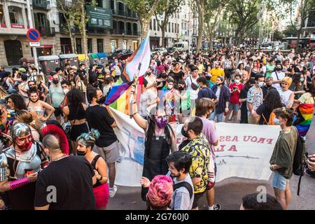 Barcelona, Catalonia, Spain. 9th July, 2021. Protesters are seen with flags.Some 500 people demonstrate in Barcelona against LGTBIphobia and the death of Samuel Luiz, a 24-year-old homosexual young man murdered in a homophobic attack last week in the city of A CoruÃ±a, Spain. Credit: Thiago Prudencio/DAX/ZUMA Wire/Alamy Live News Stock Photo