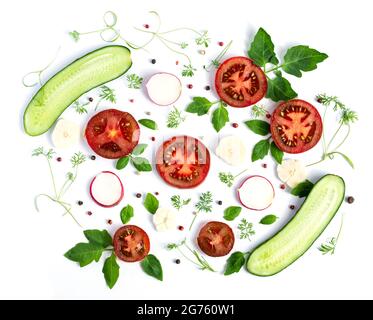 Cucumbers and tomatoes on a white background. Summer vegetarian pattern Stock Photo