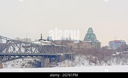 Nepean point and national gallery on the Ottawa end of the interprovincial Alexandra bridge on a cold grey winter day with snow in Ottawa, capital of Stock Photo