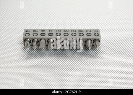 Set of attachments, bits for a screwdriver on a white background Stock Photo
