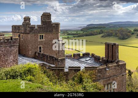 The historic Dunster Castle, on the edge of the village of Dunster, Exmoor National Park, Somerset, England Stock Photo