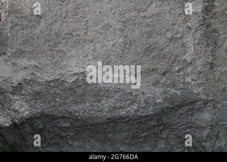 Concrete, plaster, wall covering, flooring made of small pebbles. Concrete made by mixing tiny black pebbles. Stone floor wall background brick patter Stock Photo