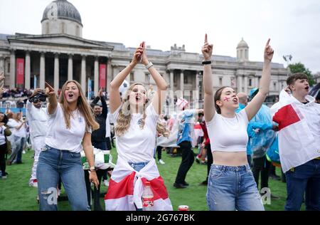 England fans watch Atomic Kitten perform at the Trafalgar Square Fan Zone in London as they watch the UEFA Euro 2020 Final between Italy and England. Picture date: Sunday July 11, 2021. Stock Photo