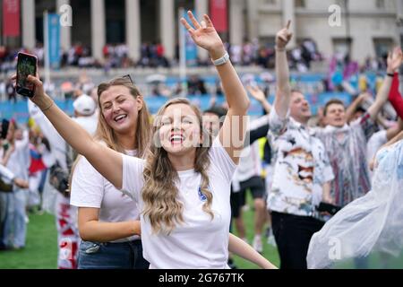 Englanf fans watch Atomic Kitten perform at the Trafalgar Square Fan Zone in London as they watch the UEFA Euro 2020 Final between Italy and England. Picture date: Sunday July 11, 2021. Stock Photo