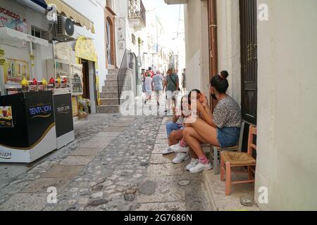 Peschici - 29/06/2021: girls enjoying ice cold slush in the street Stock Photo
