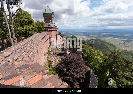 A view from the walls of Haut-Koenigsburg castle looking down into the Upper Rhine Valley. The medieval ruins were rebuilt in an idealised form from 1900 onwards on order by the German Emperor. Today it is a major tourist attraction of Alsace. Stock Photo