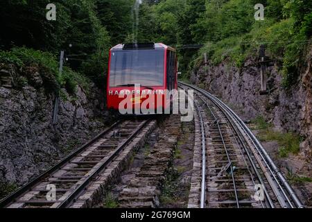 Red Funicular Train Red Funicular Train driving downhill from Harder Kulm, Top of ...