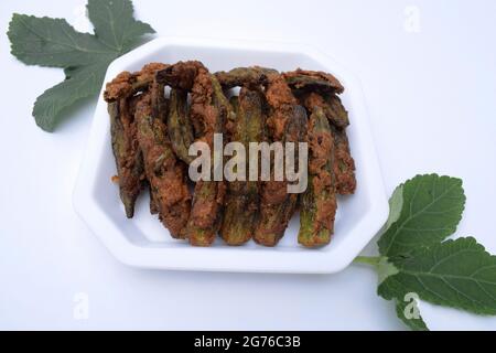 Delicious Kurkuri or Karari Bhindi. Deep fried okra or ladyfinger whole pieces crispy and crunchy starter or side dish Stock Photo