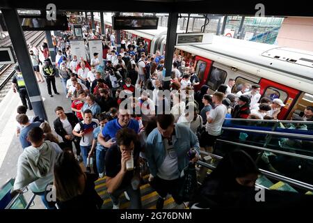London, UK. 11th July, 2021. 2020 European Football Championships Final England versus Italy; England fans leaving Wembley Park Underground station and walking towards Wembley Stadium Credit: Action Plus Sports/Alamy Live News Stock Photo