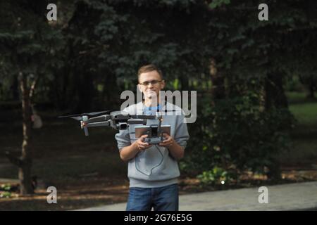 Drone pilot. Controlling the drone in the open air. Stock Photo