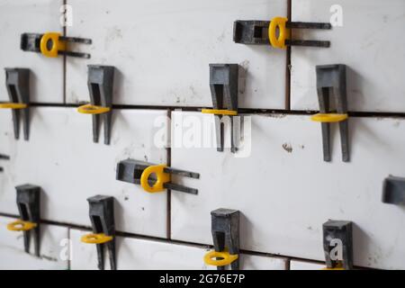 View on tile leveling system with plastic clips and wedges Stock Photo